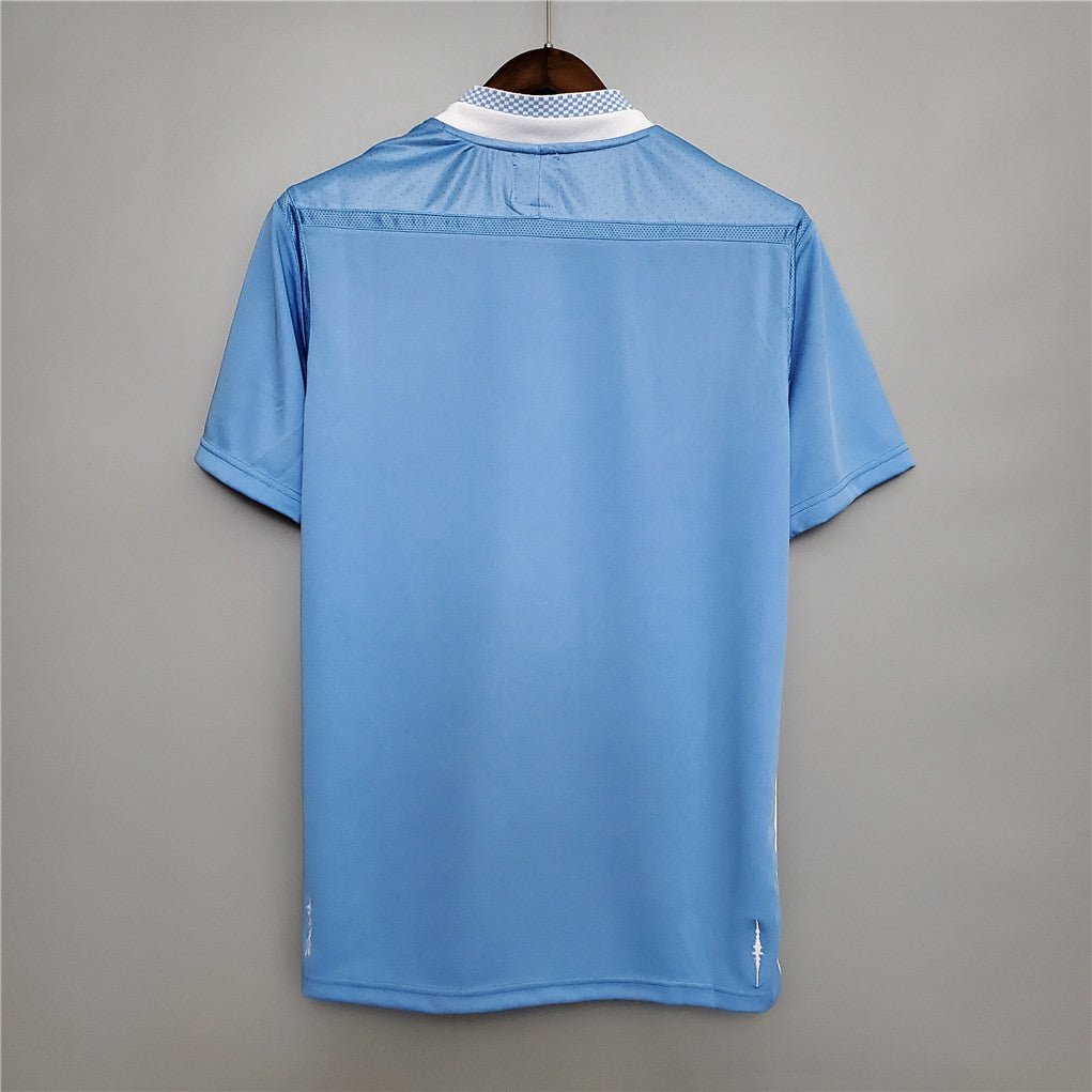 Camisola Retro Manchester City F.C. Principal 11/12