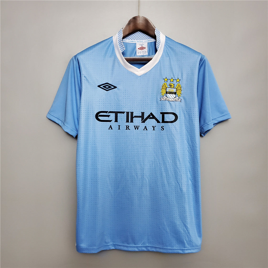Camisola Retro Manchester City F.C. Principal 11/12